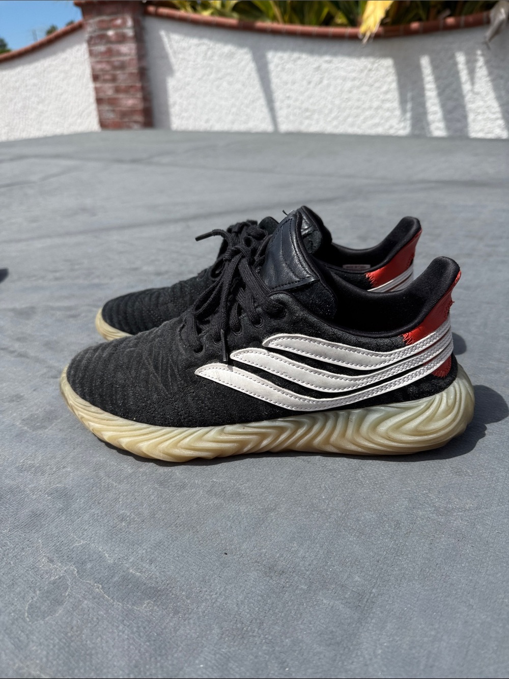 adidas Black Sneakers with White Stripes and Red Heel